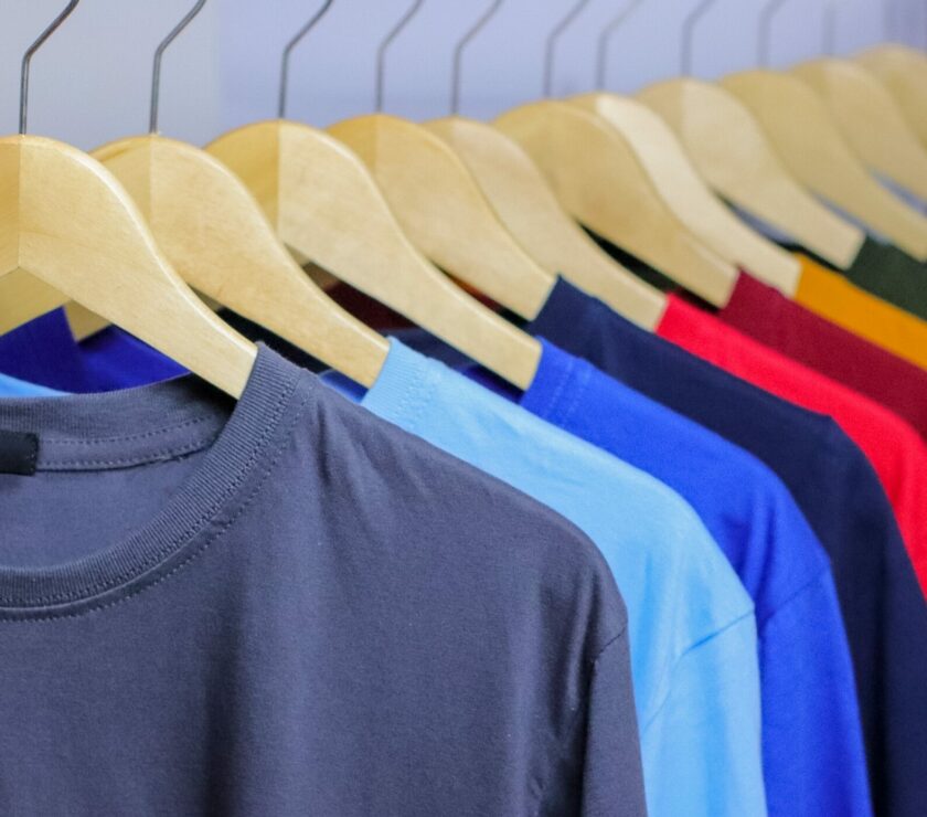 Colorful,T-shirts,On,Wooden,Hanger,Hanging,On,Clothing,Rack